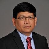 Mr. Malcolm Khan, MBA, FICB, CIM