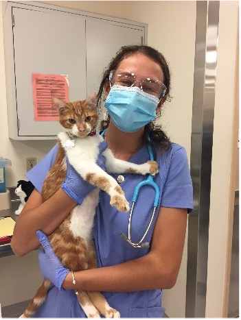 Scholarship recipient and cat