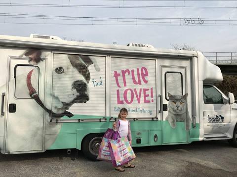 Emma outside a mobile home